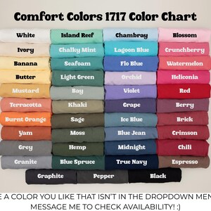 May include: A Comfort Colors 1717 color chart displaying forty-four folded t-shirts in various shades, including white, ivory, banana, butter, mustard, terracotta, burnt orange, yam, grey, granite, island reef, chalky mint, seafoam, light green, bay, khaki, sage, moss, hemp, blue spruce, graphite, pepper, chambray, lagoon blue, flo blue, orchid, violet, grape, ice blue, blue jean, midnight, true navy, black, blossom, crunchberry, watermelon, heliconia, red, berry, brick, crimson, chili, and espresso.