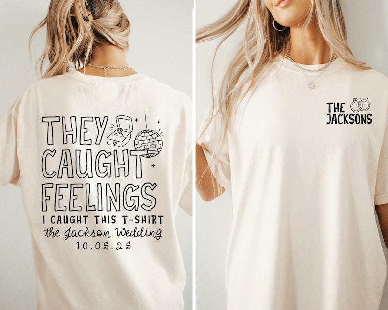 May include: Cream-colored t-shirt with black text and graphics. The back of the shirt says "THEY CAUGHT FEELINGS" with a ring box and disco ball graphic. The front has "THE JACKSONS" and rings.