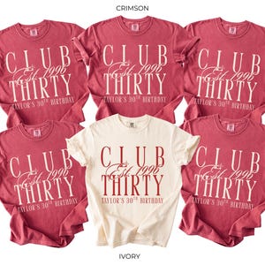 May include: Five short-sleeved t-shirts arranged in a group. Four shirts are crimson with white text, and one center shirt is ivory with crimson text. All shirts feature the text CLUB Est. 1996 THIRTY and TAYLOR'S 30TH BIRTHDAY in a serif font.
