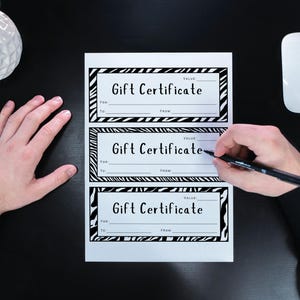 May include: Three printable gift certificate templates with a zebra print design. Each template has fields for "Value", "For", "To", and "From".