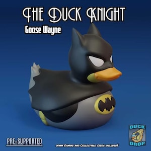 May include: A rubber duck figurine styled as a superhero with a black cowl, cape, and a grey body featuring a yellow bat emblem on the chest. The text reads THE DUCK KNIGHT, Goose Wayne, PRE-SUPPORTED, and 30mm Gaming and Collectible Sizes Included.