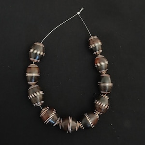 Ebony wood beads engraved with silver. Tuareg beads