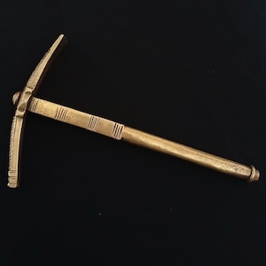 Very old brass hammer