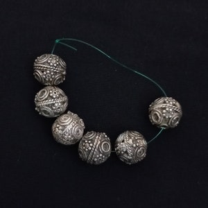 6 ancient silver beads . Antique silver jewelry