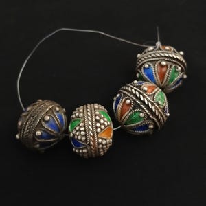 4 Beautiful antique silver berber beads with enamel from southern Morocco. Silver beads