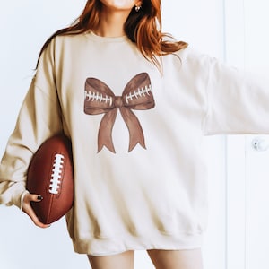 Coquette Football Bow Sweatshirt - Coquette Ribbon Shirt - Football Fan Gift - Football Ribbon Shirt - Football Team - Tailgate Gameday Gift