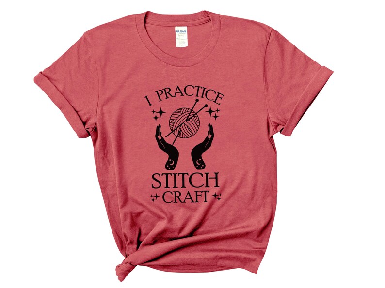 May include: Red short-sleeved t-shirt with black text that reads "I practice stitch craft" and a graphic of two hands holding a ball of yarn with knitting needles.