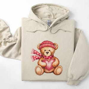 Valentine Teddy Bear Hoodie - Stuffed Bear With Heart and Scarf Hooded Sweatshirt - Cute Valentine’s Day Crewneck - Trendy Teddy Bear Gift