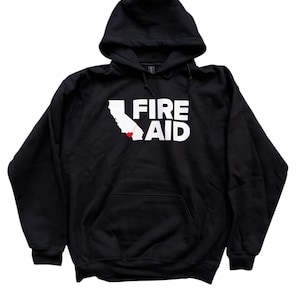 May include: Black hooded sweatshirt with a front pocket and white text that reads "FIRE AID". The design includes a white outline of California with a red heart. A casual, comfortable apparel item.