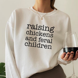 Raising Chickens And Feral Children Sweatshirt, Funny Farmer Mama Shirt, Chicken Farmer Hoodie, Mother's Day Gift For Barn Mom, E7723