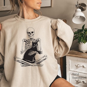 Skeleton Holding Cat Sweatshirt, Skeleton And Black Cat Shirt, Spooky Cat Lady Tee, Gothic Cat Owner Hoodie, Trendy Cat Mama Gift