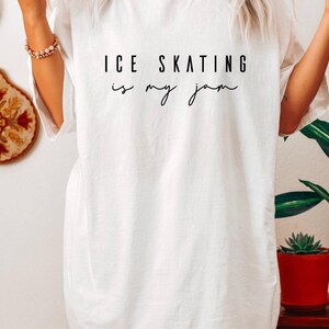 White short-sleeved t-shirt featuring the black printed text ICE SKATING is my jam