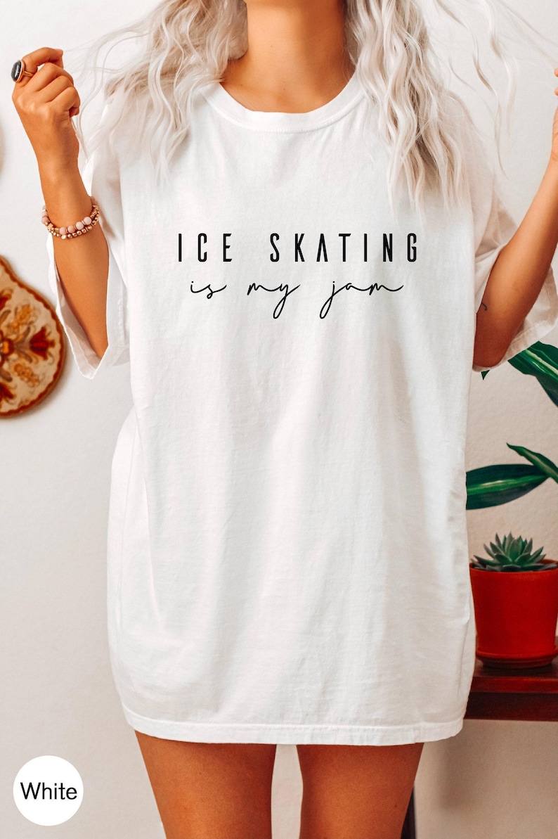White short-sleeved t-shirt featuring the black printed text ICE SKATING is my jam