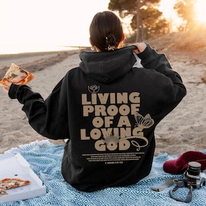 Living proof of a loving god Hoodie | comfy hoodie, faith hope love, bible verse, shop for the one, christian hoodie, christian clothing