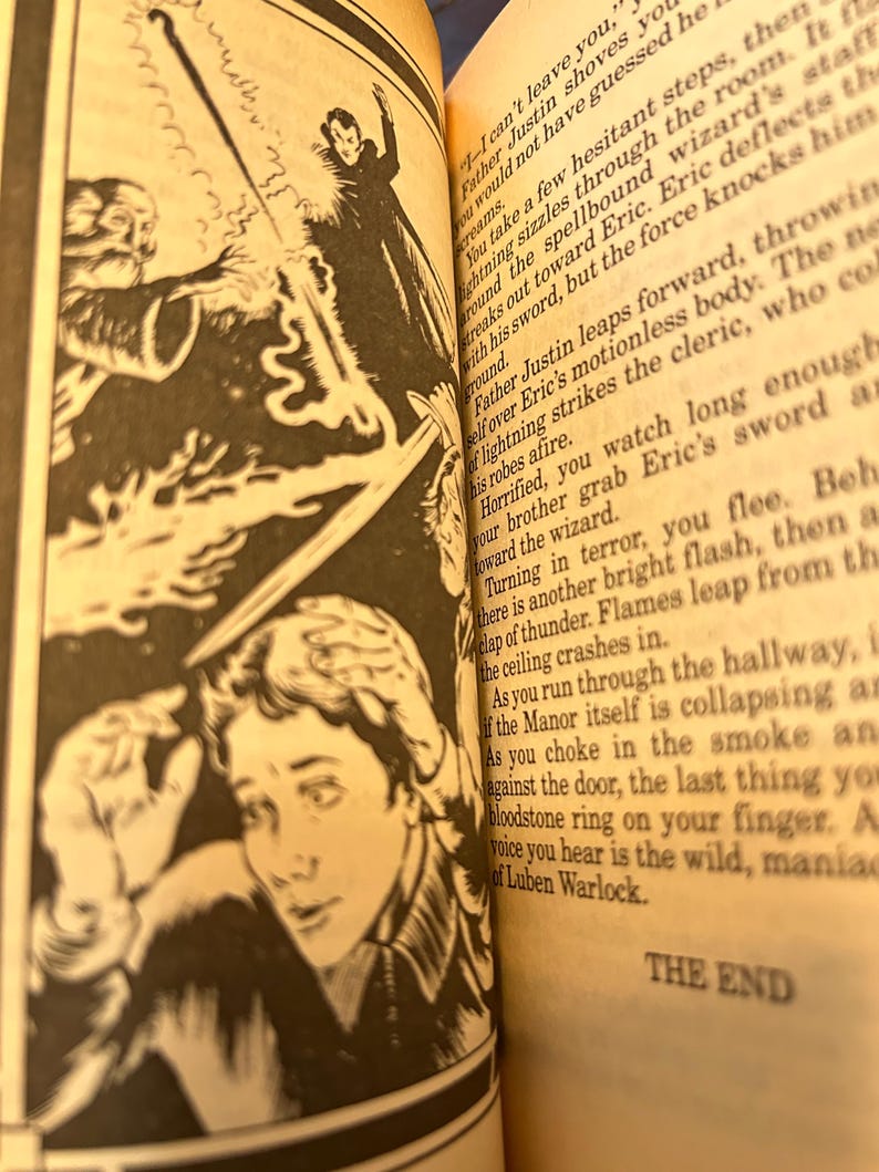 May include: Black and white illustration from a book depicting a fantasy scene. A wizard in a long coat faces off against a figure with a sword. The text "THE END" is visible.