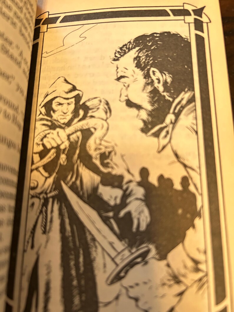 May include: Black and white illustration from a book depicting a hooded figure holding a dagger, facing a man with a beard. The scene suggests a confrontation, with other figures in the background. The artwork is framed by a decorative border.