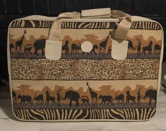 Set of four like new safari scene zip suitcase duffle shoulder & train case bags