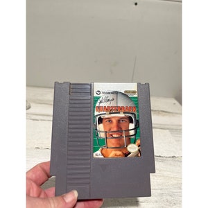 John Elway’s Quarterback NES game cartridge circa 1985