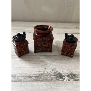 Japanese brown ceramic salt, pepper, and sugar containers