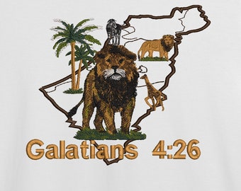 May include: White t-shirt with a brown lion, palm trees, and other animals inside a brown outline of a map. The text "Galatians 4:26" is printed in brown below the image.