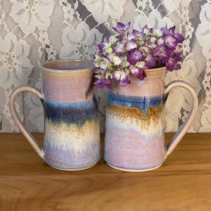 May include: A handmade wooden sign with the text "Welcome" in a playful font. The sign features a distressed white background and a dark brown border, suitable for indoor or outdoor use.