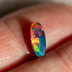 0.7CT Lightning Ridge Opal Doublet, Oval, Black Potch backing, Bright and Fiery Blue, Green, Red, Orange, Yellow!