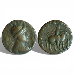 May include: Two antique bronze coins. One coin features a figure holding an object, the other depicts a horse and rider. Both coins have a circular shape and show signs of wear and age, with a dark, aged patina.