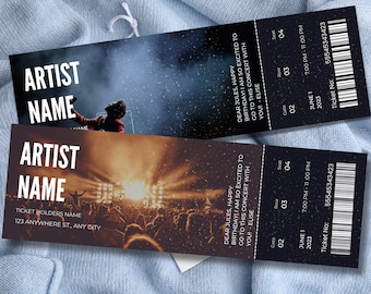 May include: Two concert tickets with a black background and silver glitter. The top ticket has a photo of a stage with a performer on it. The bottom ticket has a photo of a crowd at a concert. The text on the tickets reads "Artist Name" and "Dear Jules, Happy Birthday! I am so excited to go to this concert with you! - Elise". The tickets are dated June 1, 2023, and the time is 7:00 PM - 11:00 PM. The ticket number is 55545343423.