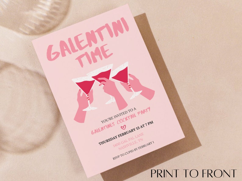 May include: Pink invitation card with the text "Galentini Time" in white lettering. The card features a graphic of three hands holding pink cocktails and the text "You're invited to a Galentines Cocktail Party" with the date and time of the party.