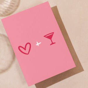May include: Pink card with a red heart and a red cocktail glass with a white outline. The text "+" is between the heart and the glass.