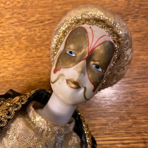 Vintage Harlequin Porcelain Doll Wearing Black and Gold