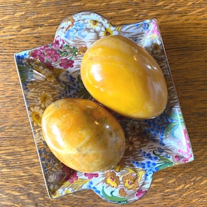 Pair of Vintage Gold Orange Polished Marble Egg Shaped Paperweight