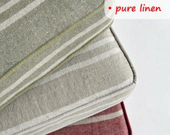 May include: Close-up of three square cushions with striped patterns. The top cushion is olive green with white stripes, the middle one is gray with white stripes, and the bottom one is burgundy with white stripes. The text "Customize, handmade, pure linen" is visible.