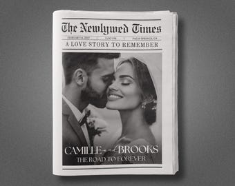 May include: A black and white photograph of a couple on their wedding day. The headline reads "The Newlywed Times" with the date "February 14, 2017" and the time "5:00 PM". The location is "Palm Springs, CA". The sub-headline reads "A Love Story to Remember". The couple's names are "Camille and Brooks" and the tagline reads "The Road to Forever".
