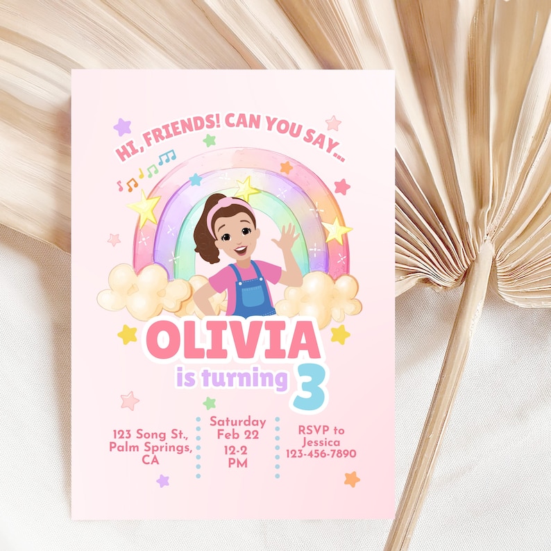 May include: A pink birthday invitation featuring a cartoon girl in front of a rainbow. The invitation reads "Olivia is turning 3" with event details and RSVP information. Decorative stars and musical notes are scattered around the design.