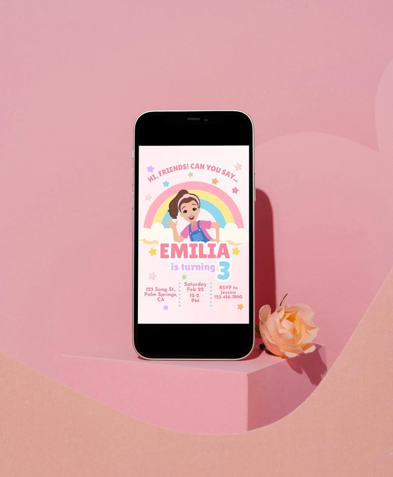Pastel-themed birthday invitation featuring a cartoon girl inspired by Ms. Rachel, waving with a cheerful expression. The design includes a rainbow, clouds, and colorful stars on a light pink background. The text reads, 'Hi, friends! Can you say…' followed by 'Emilia is turning 3' in bold pink and purple letters. Below, event details such as date, time, location, and RSVP contact are displayed in a playful font. Simply edit, save, and print or share digitally!
