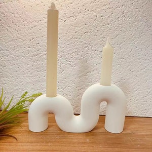 Curved candle holder