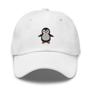 May include: White baseball cap with an embroidered penguin design. The penguin is black and white with orange feet.