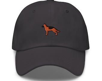 May include: A dark gray baseball cap with an embroidered orange German Shepherd silhouette.