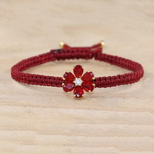 Ruby Macrame Bracelet with Gold Flower Charm, Maroon Red Braided Cord Bracelet, July Birthstone Gift for Women