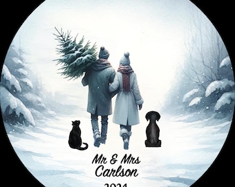 May include: A winter scene with a couple walking through a snowy forest with a Christmas tree. The couple are holding hands and walking towards a bright light. The text "Mr. & Mrs. Carlson 2024" is at the bottom of the image.