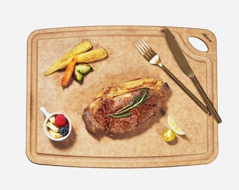 May include: A wooden cutting board with a brown, textured surface. A cooked steak, corn, carrots, and a small bowl of fruit are on the board. Two gold utensils and a silver knife are on the board. The board has the text "elhome" in the top right corner.