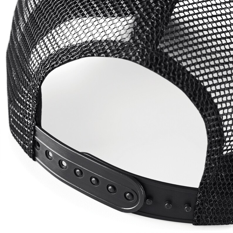 May include: Black mesh trucker hat with a black adjustable plastic strap and buckle closure.