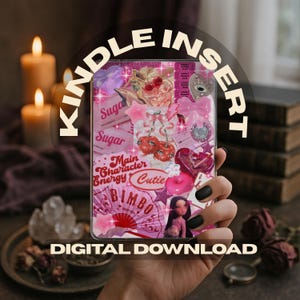 May include: A Kindle insert with a collage of pink and red elements, including cherries, stars, and a doll. The words "KINDLE INSERT" and "DIGITAL DOWNLOAD" are displayed. The insert is held by a hand with black nail polish.