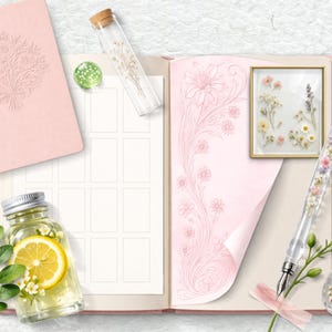May include: A pink journal with an embossed floral design, an open notebook with floral illustrations, and a glass pen filled with flowers. A small bottle with a lemon slice and a framed floral arrangement are also present.