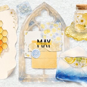 May include: A collage featuring a honeycomb pattern on paper, a clear resin gothic arch frame with layered paper scraps labeled MAY, a glass jar with lemon slices and daisies, and a blue gradient envelope with floral inserts and a heart accent.