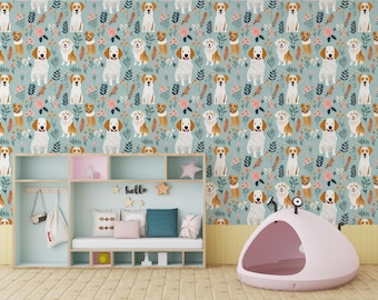 May include: A light blue wallpaper featuring a repeating pattern of various dog breeds, flowers, and leaves. Below, a light wood storage unit with cubbies holds pillows and a white bag. A pink, dome-shaped pet bed sits on the wooden floor.