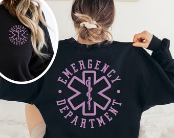 May include: Black sweatshirt with a purple "Emergency Department" graphic featuring a stylized medical star of life.