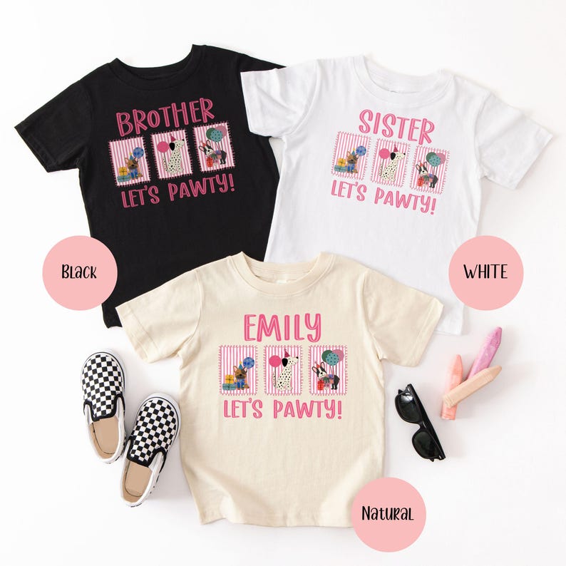 May include: Three short-sleeved t-shirts in black, white, and natural colors. Each shirt has a pink graphic with the text "BROTHER", "SISTER", or "EMILY" above the phrase "LET'S PAWTY!" and dog illustrations.