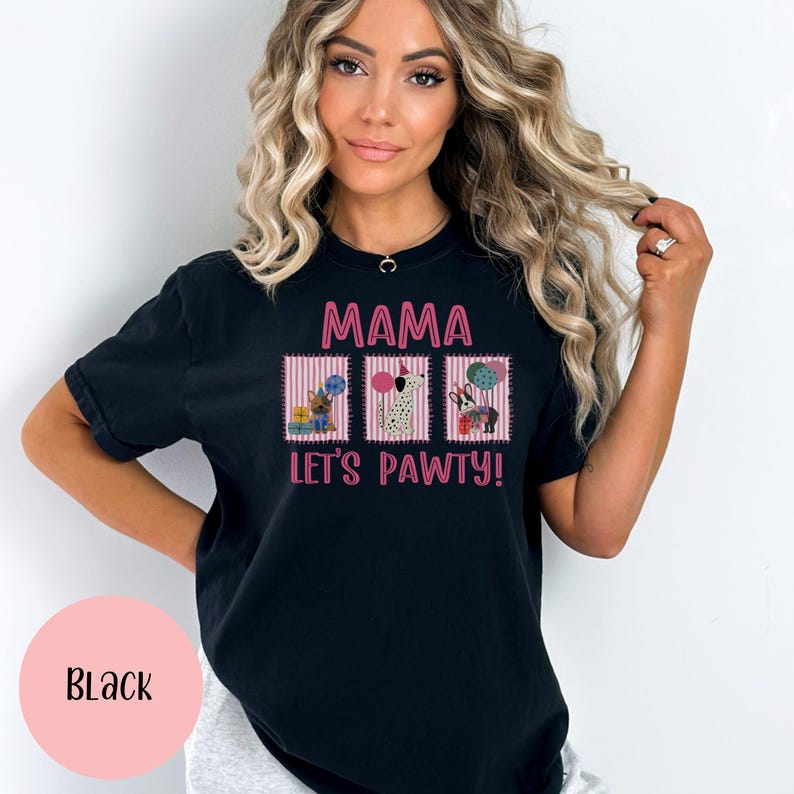 May include: Black t-shirt with the text "MAMA LET'S PAWTY!" in pink. The shirt features three rectangular graphics with cartoon dogs, gifts, and balloons. The shirt is a comfortable, casual style.